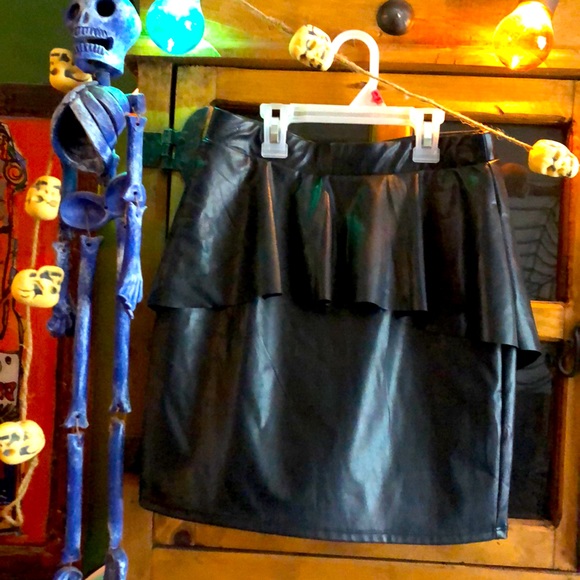A totally cool vegan leather black peplum skirt. - Picture 2 of 6